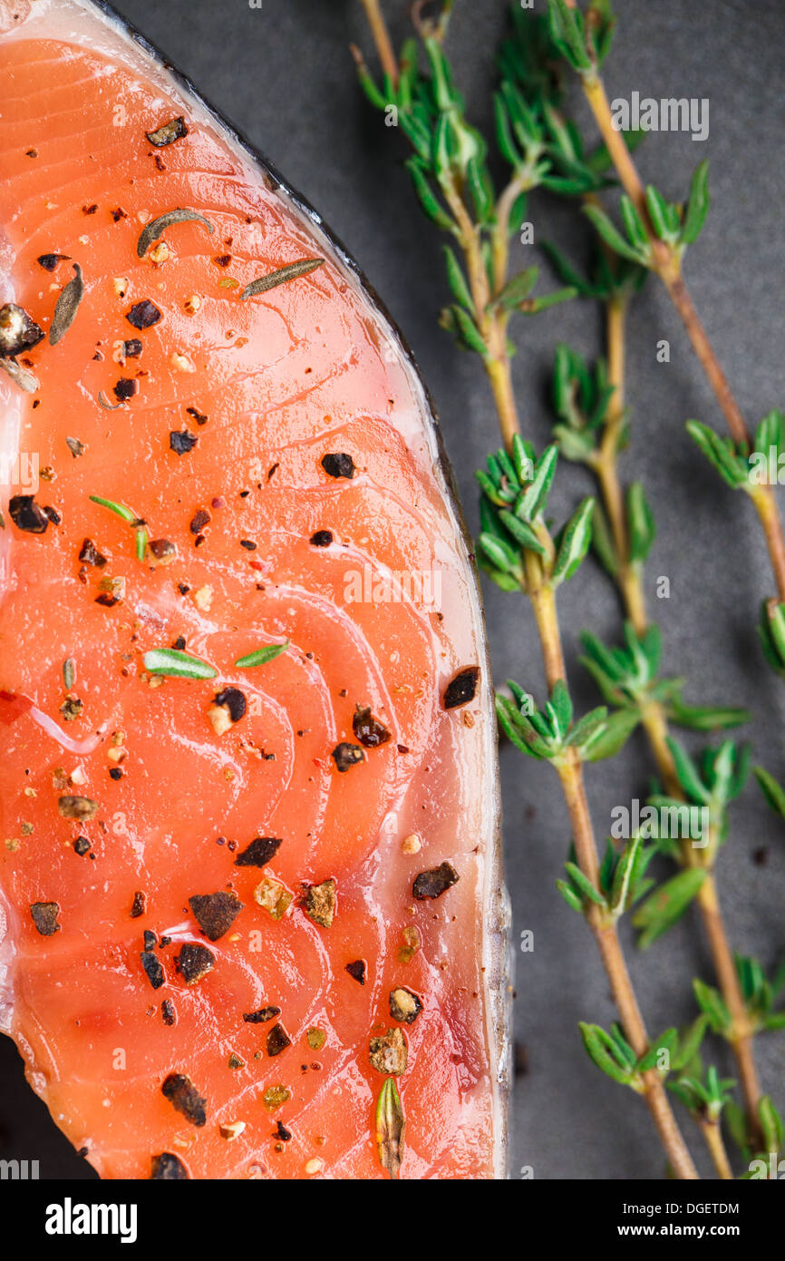 Salmon steak with thyme and pepper Stock Photo Alamy