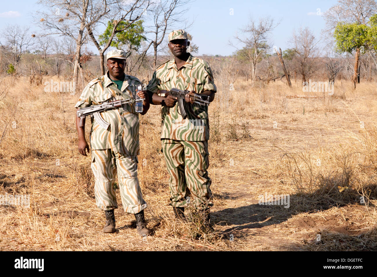 Wildlife Conservation Africa - Two Zambian wildlife rangers guard against poaching of white rhinos in Mosi oa Tunya National Park, Zambia Africa Stock Photo