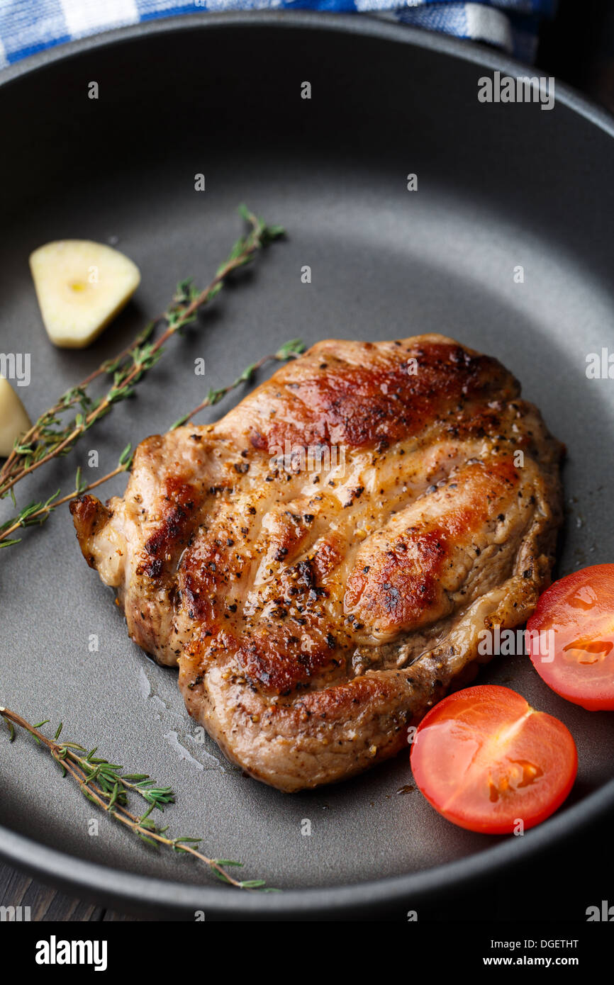 Steak with thyme, tomato and garlic Stock Photo Alamy