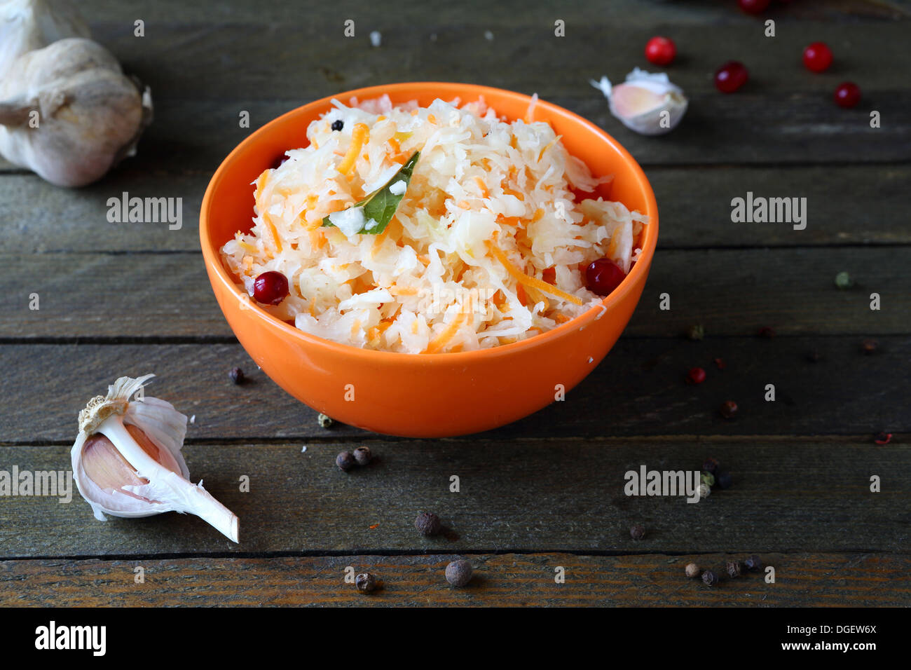 tasty pickled cabbage with garlic and cranberries, food close up Stock Photo