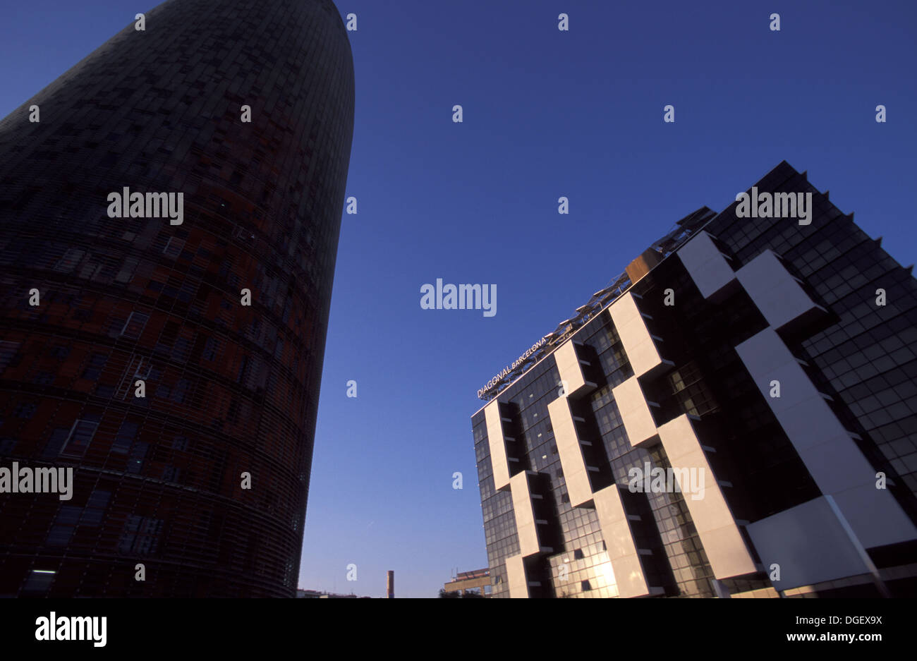 Hotel Diagonal and Torre Agbar (Jean Nouvel) is a 38-story skyscraper.  Avinguda Diagonal Barcelona. Stock Photo