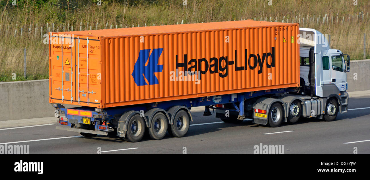 Hapag-Lloyd container loaded onto Maritime articulated trailer and hgv lorry truck M25 motorway road London orbital route Essex England UK Stock Photo