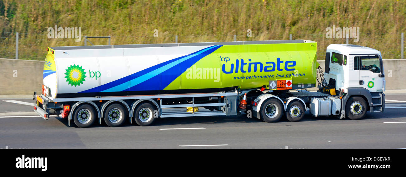 BP fuel delivery tanker lorry driving along motorway and displaying Hazchem Hazardous Chemicals Dangerous Goods sign Stock Photo