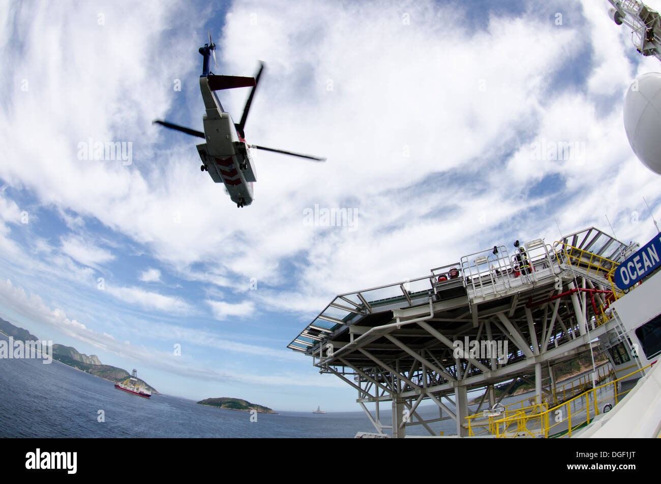Helicopter landing/departing from an offshore oil drilling ship, Ocean