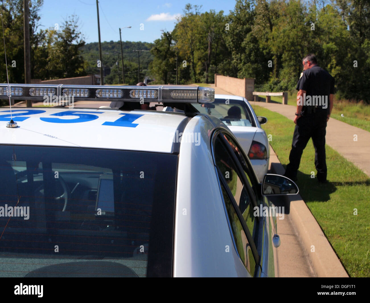 Nashville Metropolitan police department officer speaking to occupants of a car in Nashville, Tennessee, USA Stock Photo