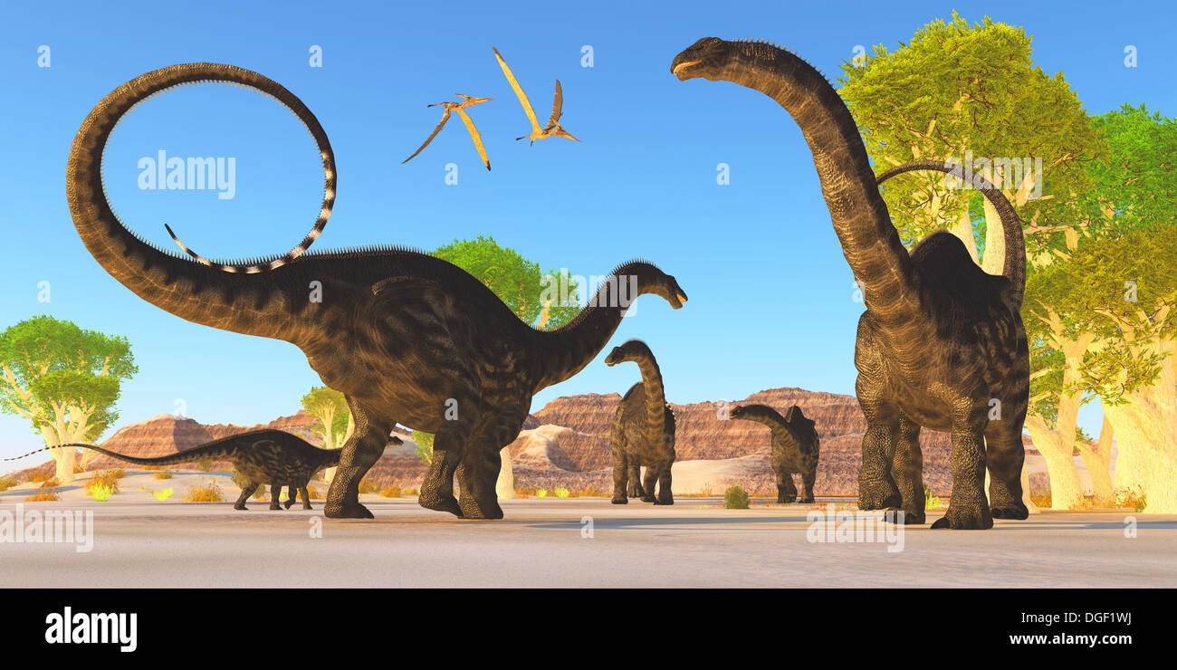 Two Pterosuar fly over a herd of Apatosaurus dinosaurs as they wonder through a prehistoric forest. Stock Photo