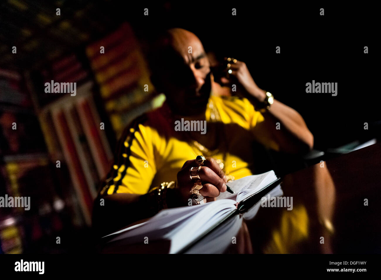 A Colombian ‘brujo’ calling himself Shaman Llanero, provides consultation over the phone in his office in Bogota, Colombia. Stock Photo