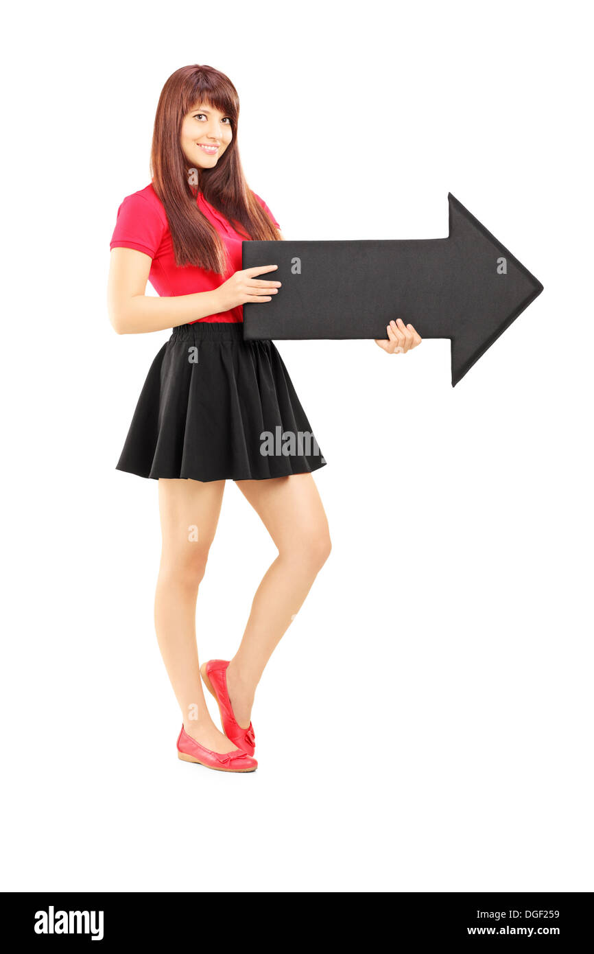 Full length portrait of a young woman in dress holding a big black ...