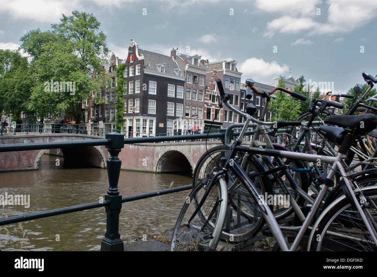 Bikes along the canals in Amsterdam Stock Photo Alamy