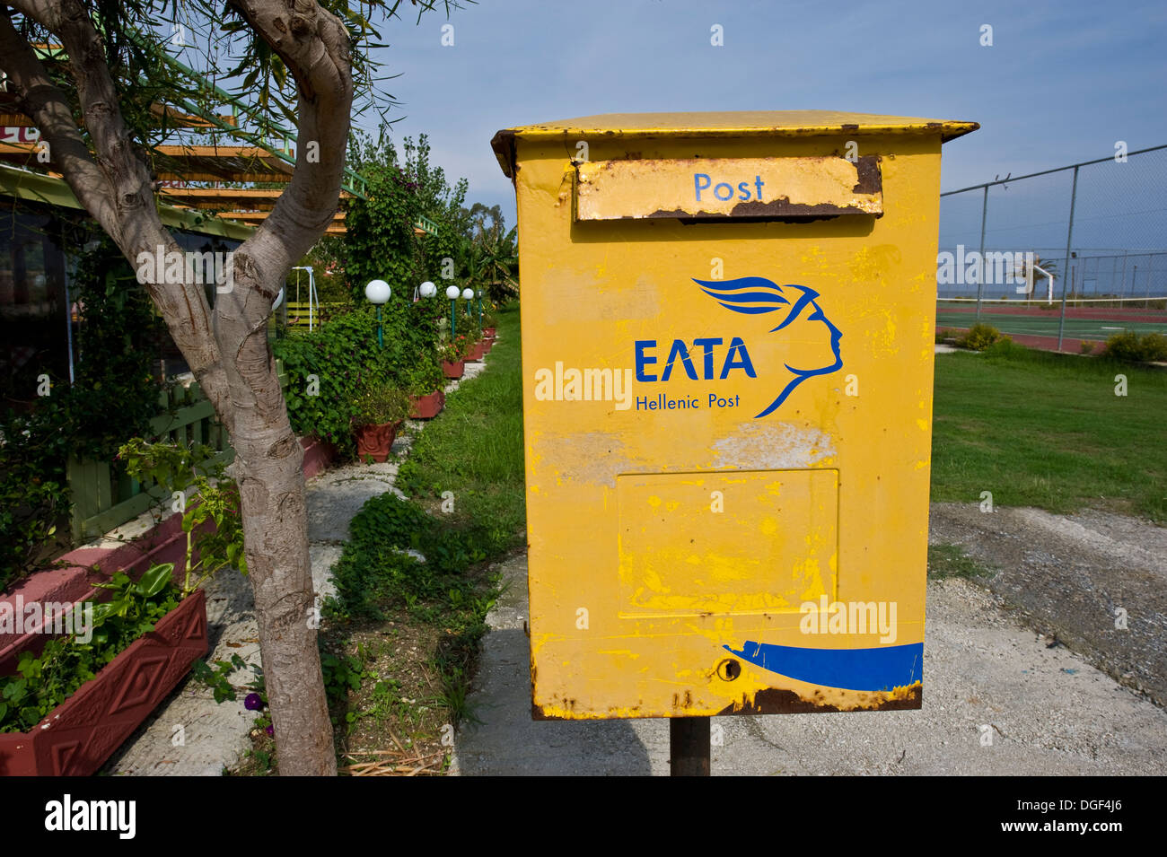 A neglected pillar box of the Greek Post Office in Sidari on Corfu Island. Stock Photo