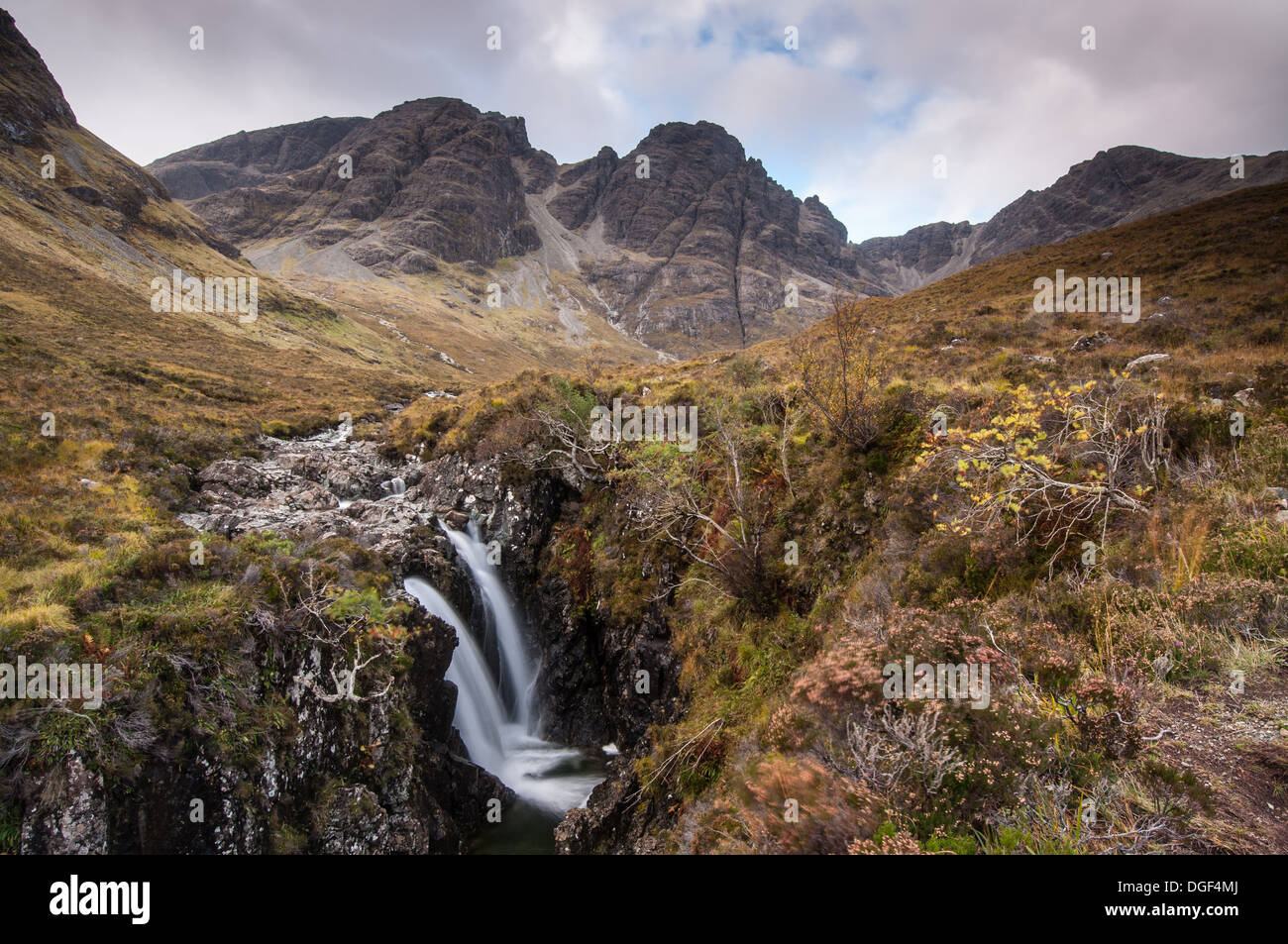Autumn colour around waterfalls on the Allt na Dunaiche, with Bla Bheinn and Clach Glas in the background, Isle of Skye Stock Photo