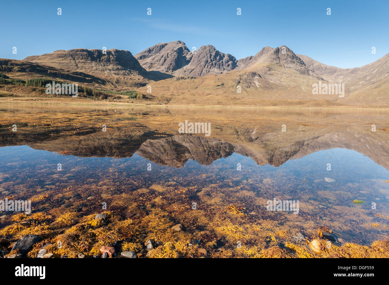 Bla Bheinn, outlying hill of the Black Cuillin mountain range, reflected in Loch Slapin from Torrin, Isle of Skye, Scotland Stock Photo