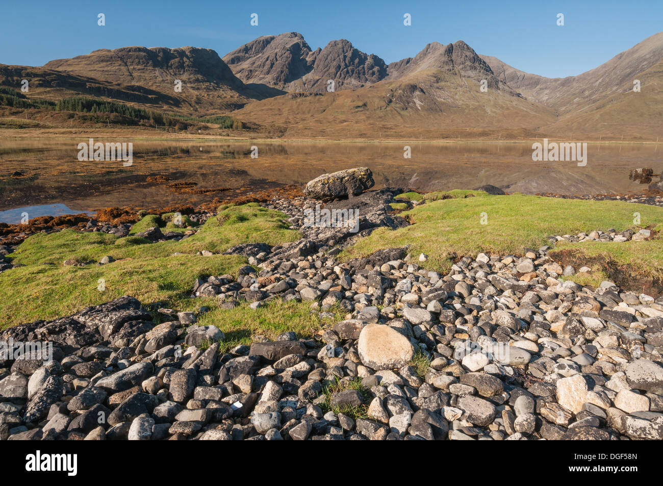 Rocky shore of Loch Slapin at Torrin, with Bla Bheinn and Clach Glas in the background, Isle of Skye Stock Photo