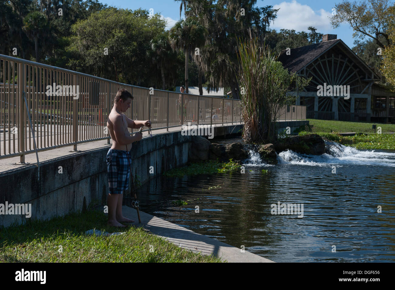 De Leon Springs State Park in Central Florida USA. A boy fishing with
