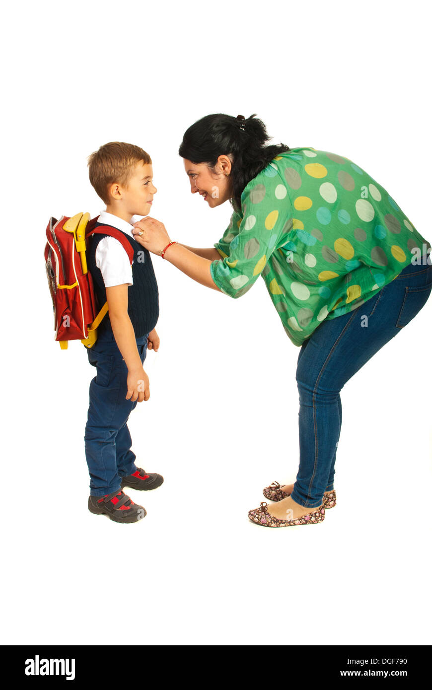 Mother prepare boy for school isolated on white background Stock Photo
