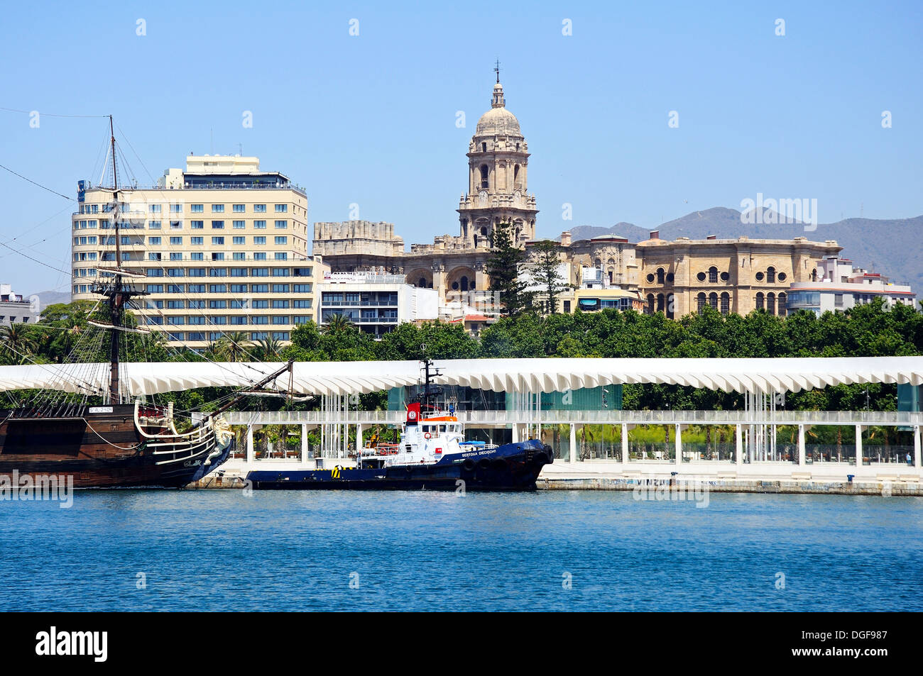 Boats in the harbour with Cathedral to the rear, Malaga, Andalusia, Spain, Western Europe. Stock Photo
