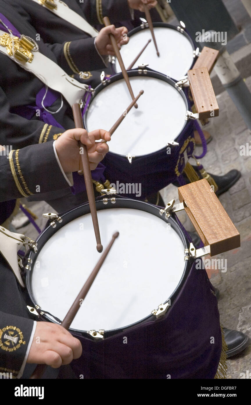 forefront of the hands of three musicians playing the drum Stock Photo