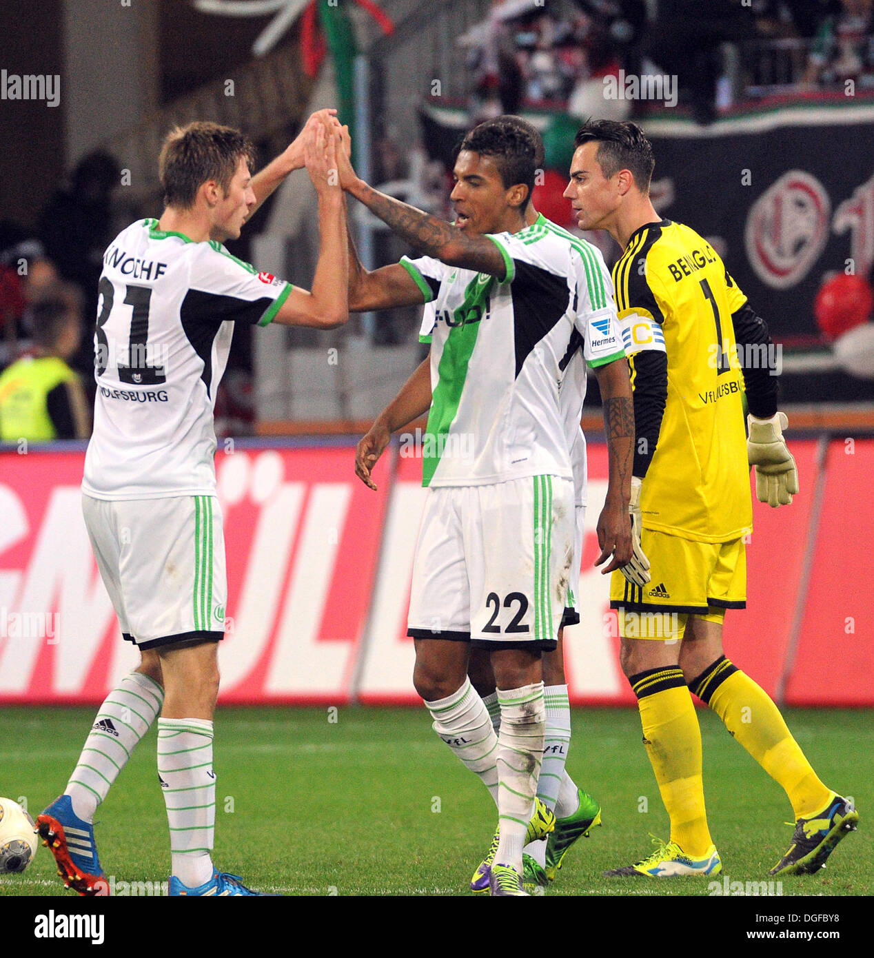Augsburg, Germany. 20th Oct, 2013. Wolfsburg's Robin Knoche, Luiz Gustavo and goalkeeper Diego Benaglio celebrate the 2-1 victory in the German Bundesliga soccer match between FC Augsburg and VfL Wolfsburg at the SGL-Arena in Augsburg, Germany, 20 October 2013. Photo: STEFAN PUCHNER (ATTENTION: Due to the accreditation guidelines, the DFL only permits the publication and utilisation of up to 15 pictures per match on the internet and in online media during the match.)/dpa/Alamy Live News Stock Photo
