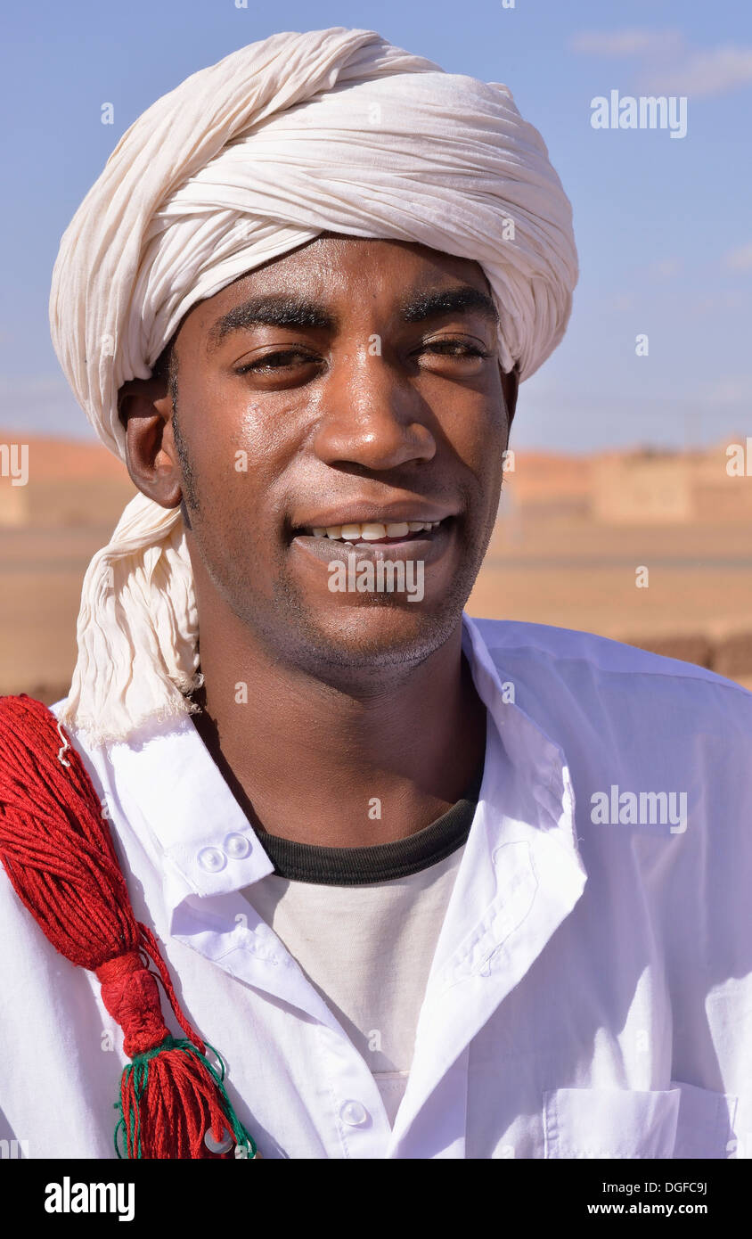 Gnaoua musician with a turban, Merzouga, Meknès-Tafilalet region, Morocco Stock Photo