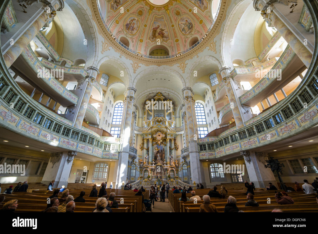 Visitors praying, Dresden Frauenkirche church, Dresden, Saxony, Germany Stock Photo