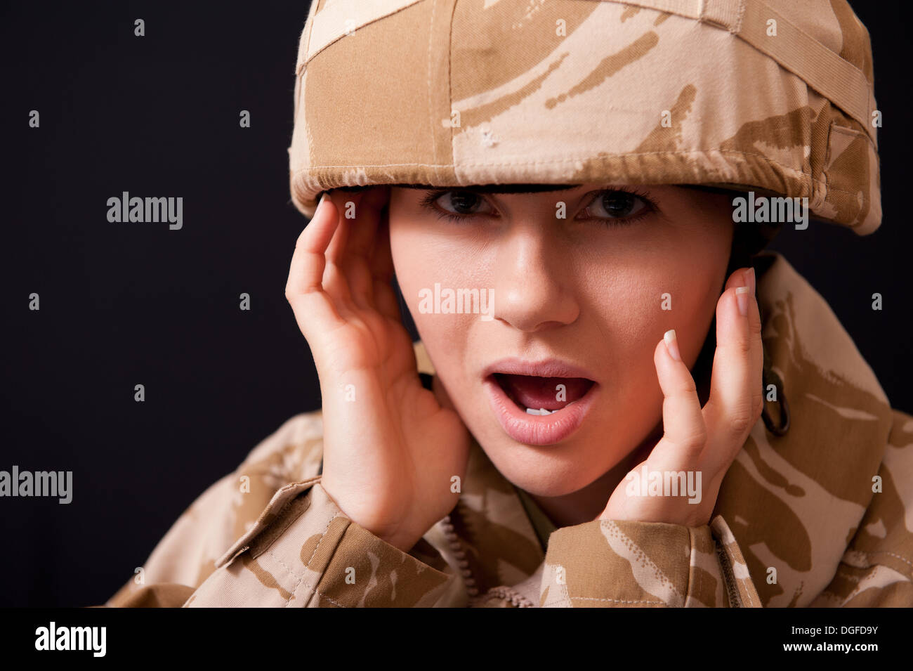 Distraught young female soldier wearing British Military uniform ...