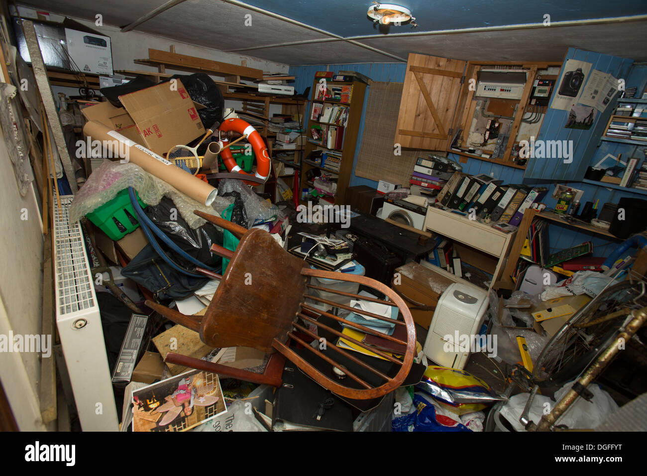 Hoarding is a type of behavior characterized by acquiring and failing to throw out a large number of items Stock Photo