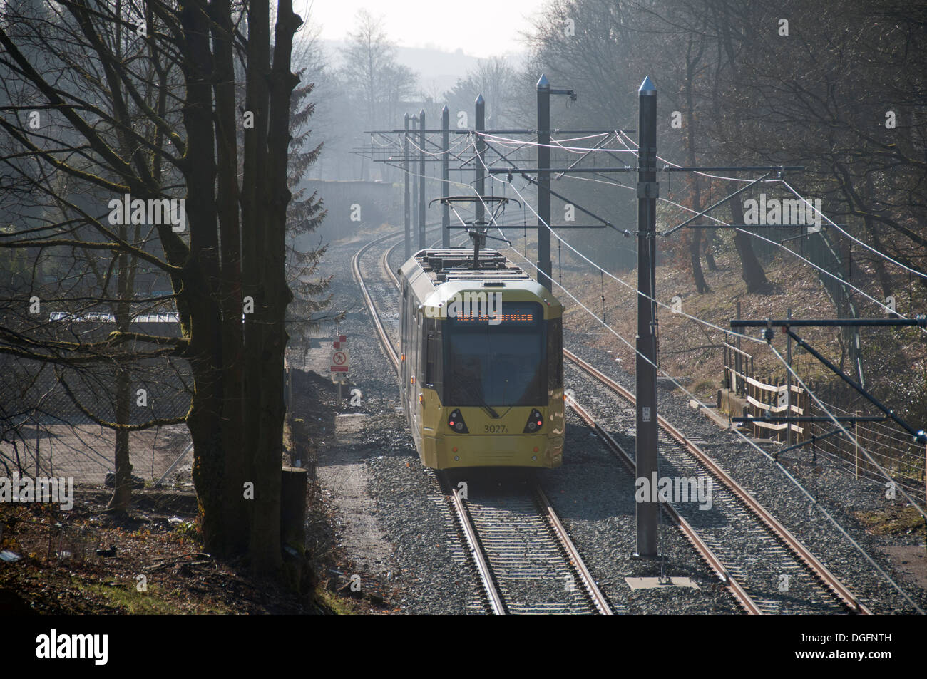 Metrolink tram on the Oldham-Rochdale line in the Beal valley near Jubilee, just north of Shaw, Oldham, Manchester, England, UK Stock Photo