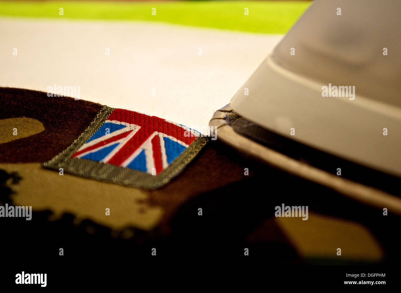 British military uniform camouflage with Union Jack flag being ironed Stock Photo