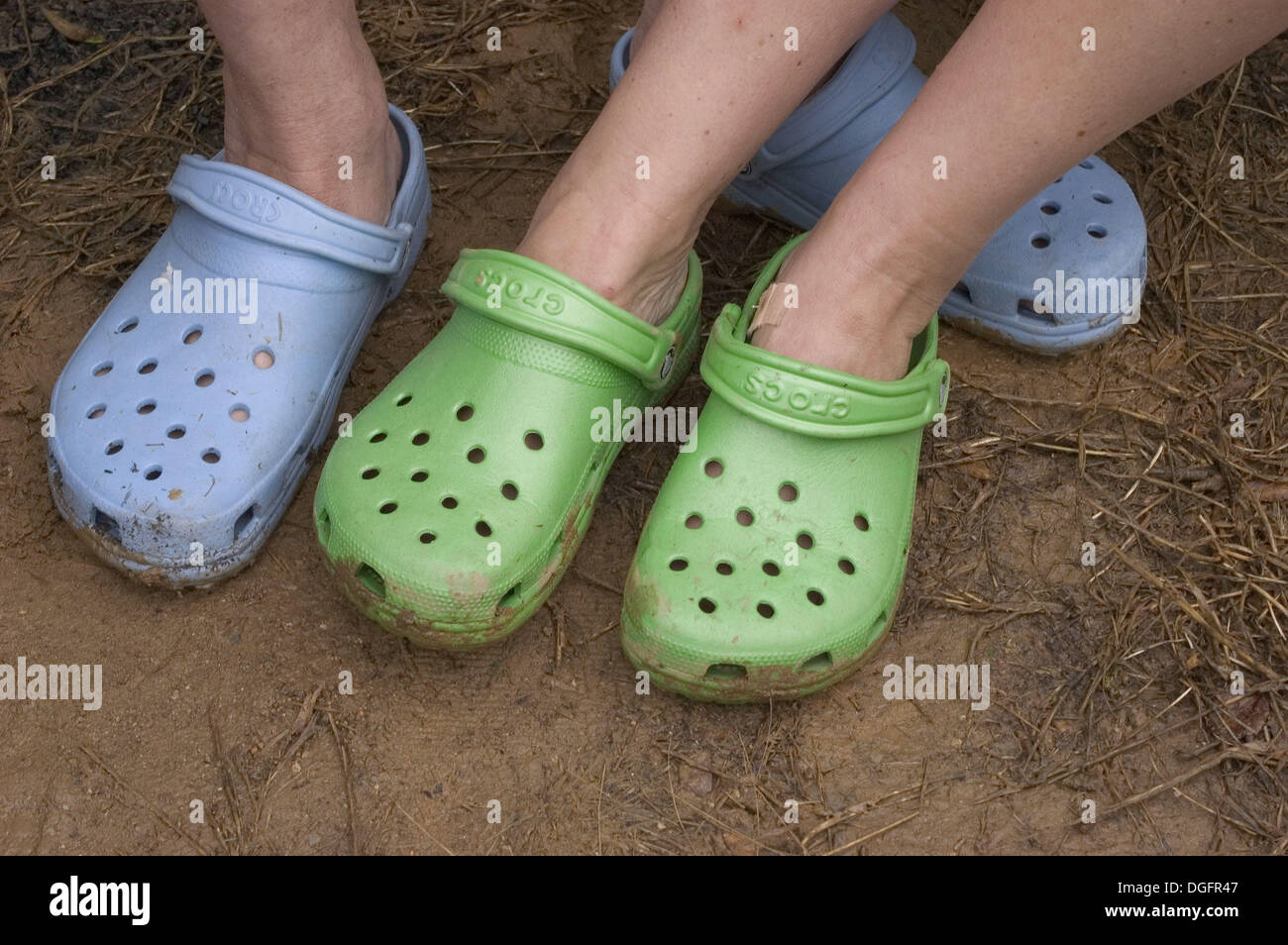 Colorful shoes in mud Stock Photo - Alamy