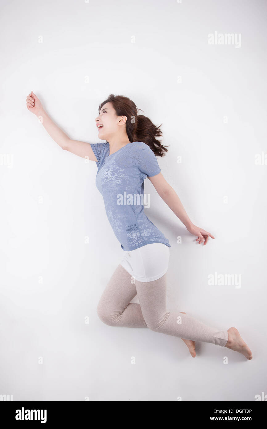 Woman arm up lying down hi-res stock photography and images - Alamy