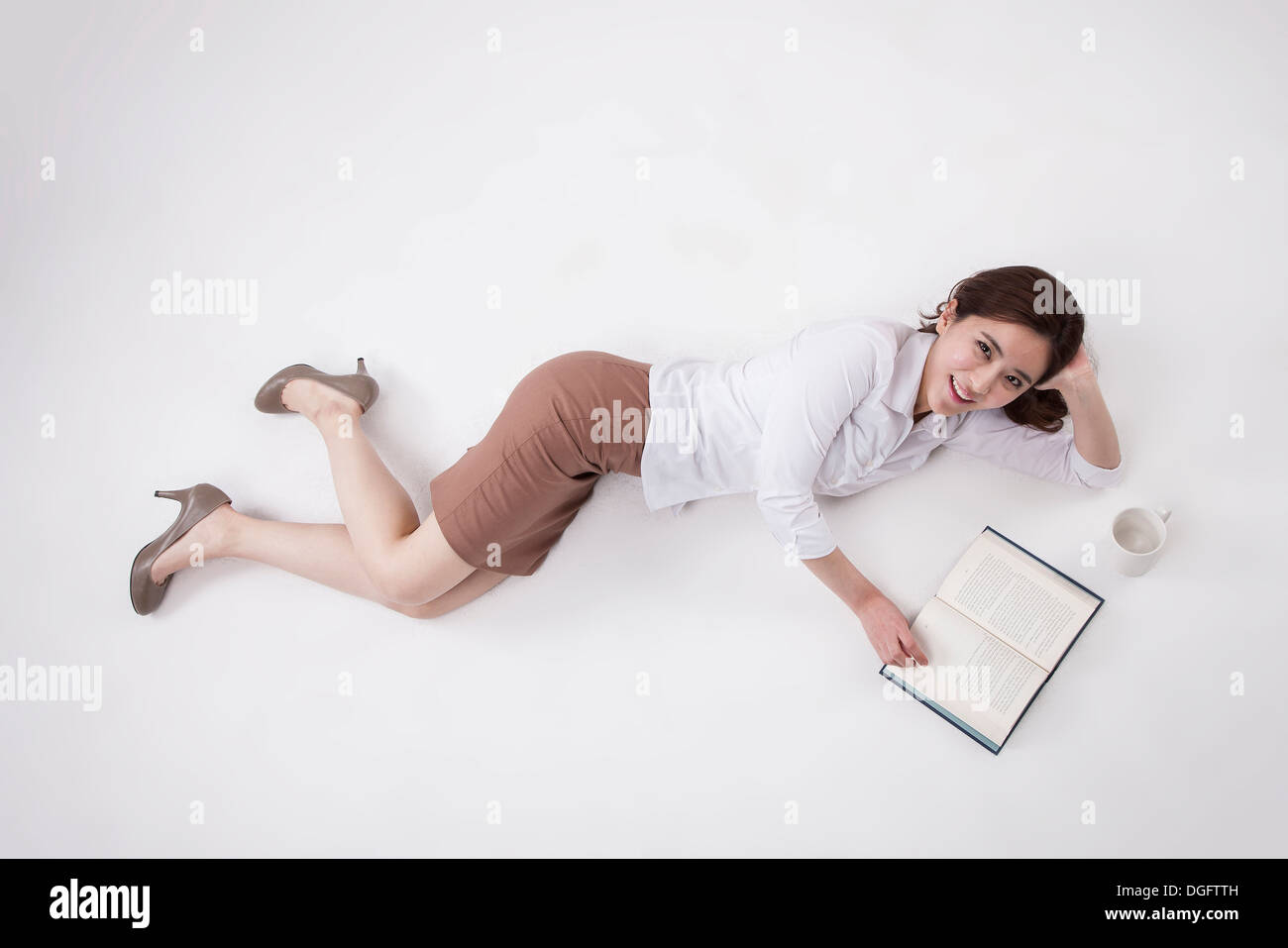 a business woman lying on the floor Stock Photo Alamy