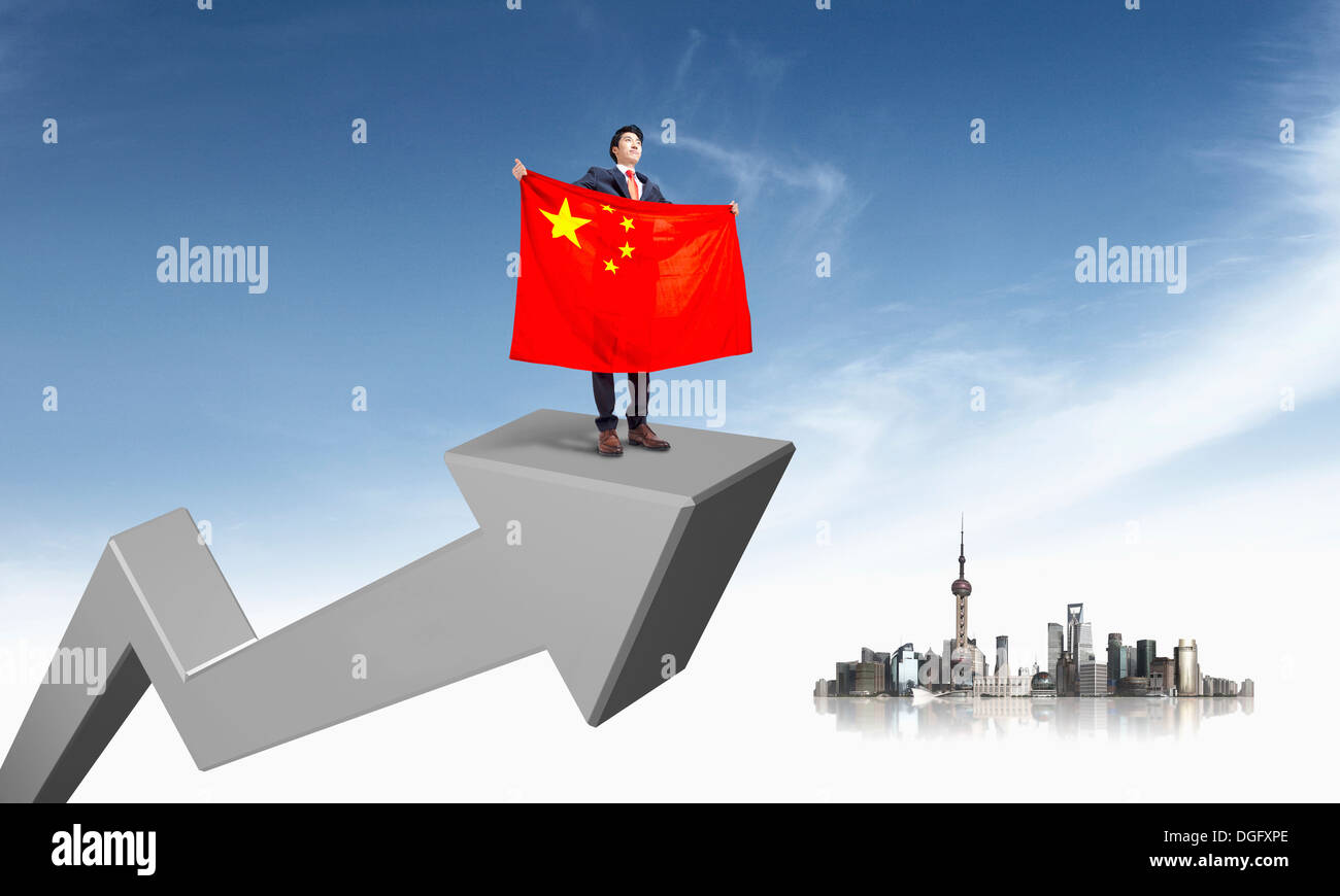 a business man holding a Chinese flag on top of the arrow Stock Photo ...