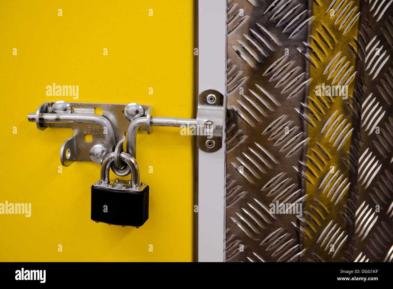 Download Padlock On A Yellow Metal Door Stock Photo Alamy Yellowimages Mockups
