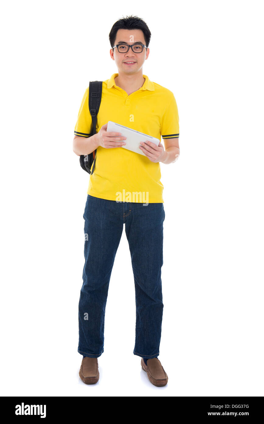 Young Asian student using pad PC isolated on white background. Stock Photo