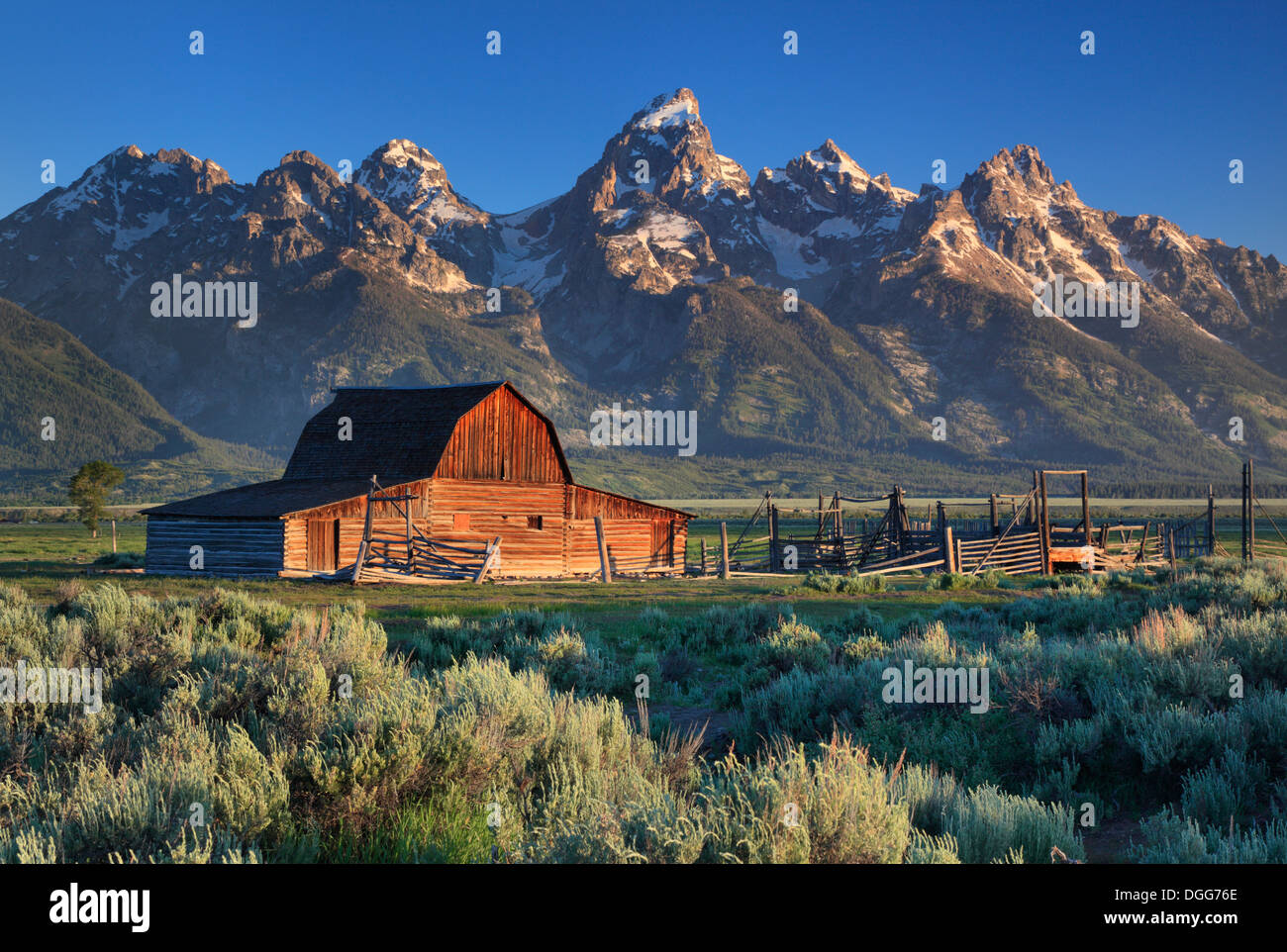 The iconic north Moulton Barn and the Teton Mountains along Antelope Flats Road in Grand Teton National Park, Wyoming Stock Photo
