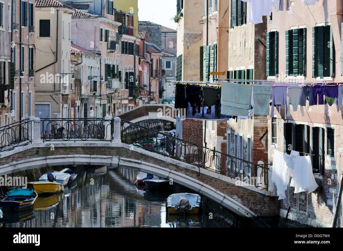 Bridge over Rio de Sant'Ana, washing hanging on washing lines, houses along a canal, Castello, Venice, Venezia, Veneto, Italy Stock Photo