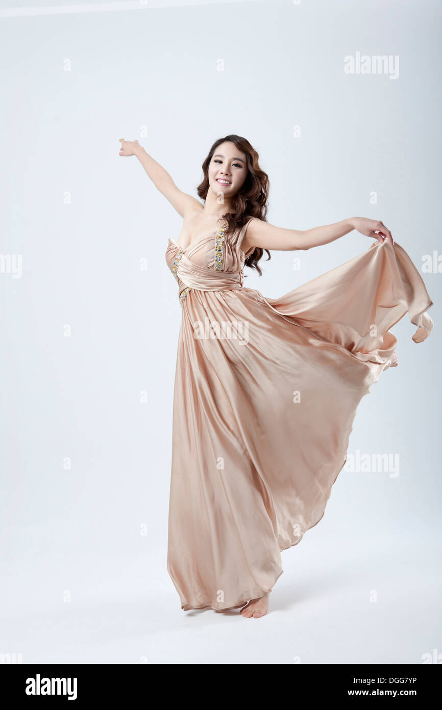 a woman with a light brown dress Stock Photo