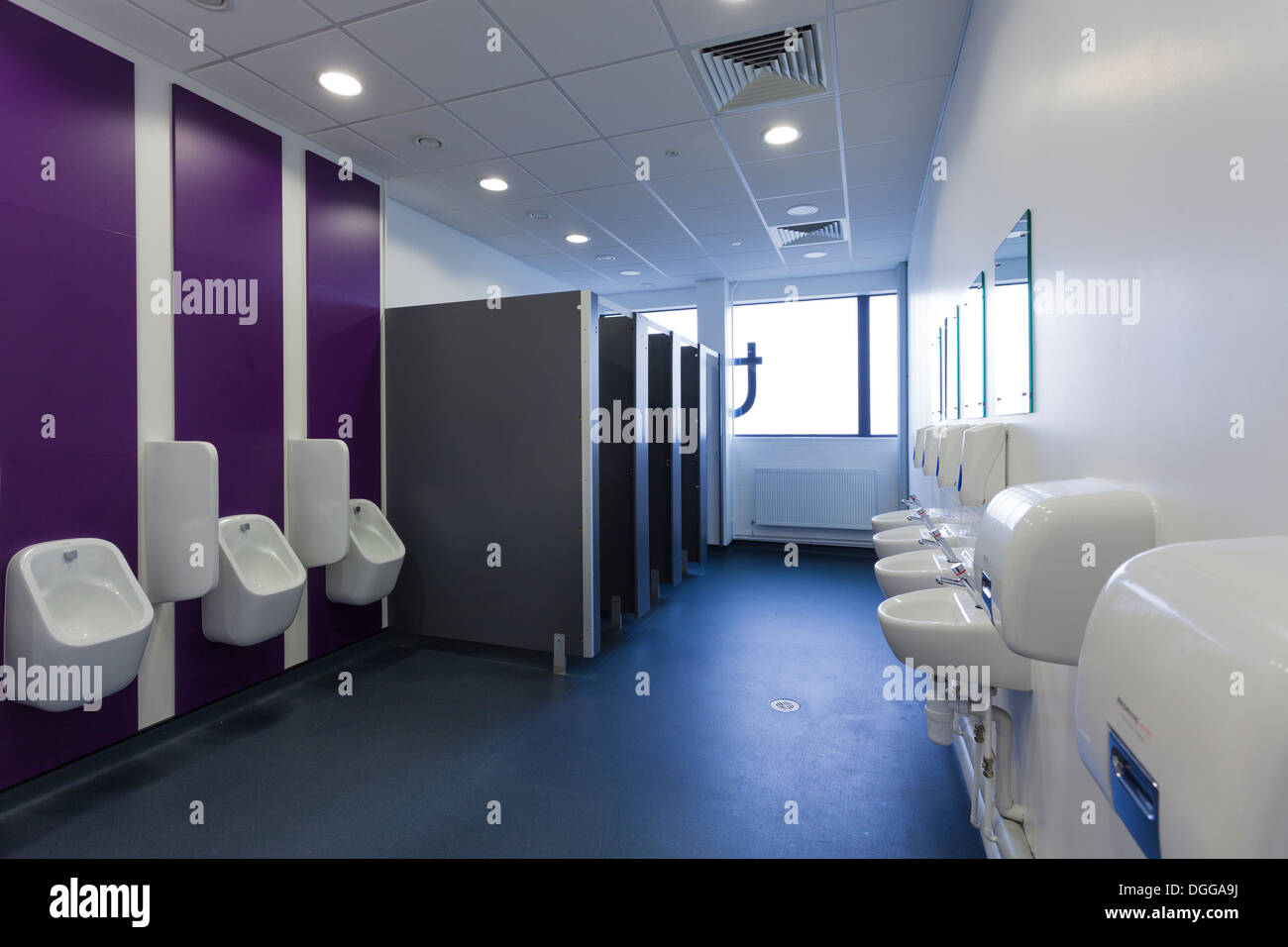 unoccupied male toilets in commercial building Stock Photo