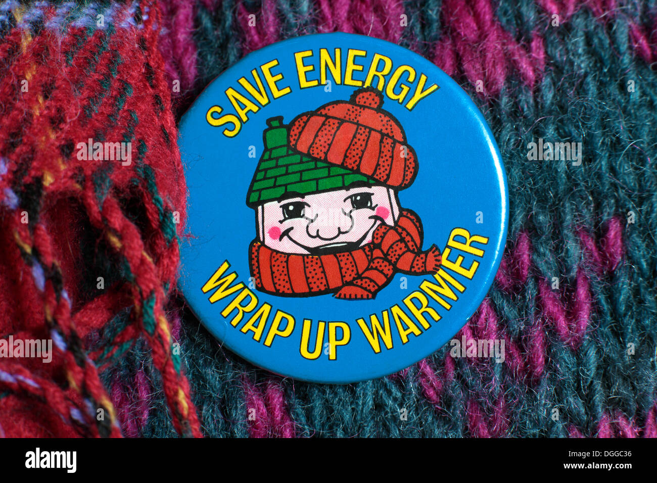 'Save Energy - Wrap up Warmer' - an energy conservation badge from around 1980  produced by a British government department or a related quango. Stock Photo