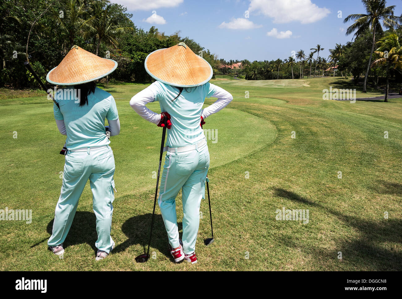 Two Caddies On Bali Golf Course Stock Photo Alamy