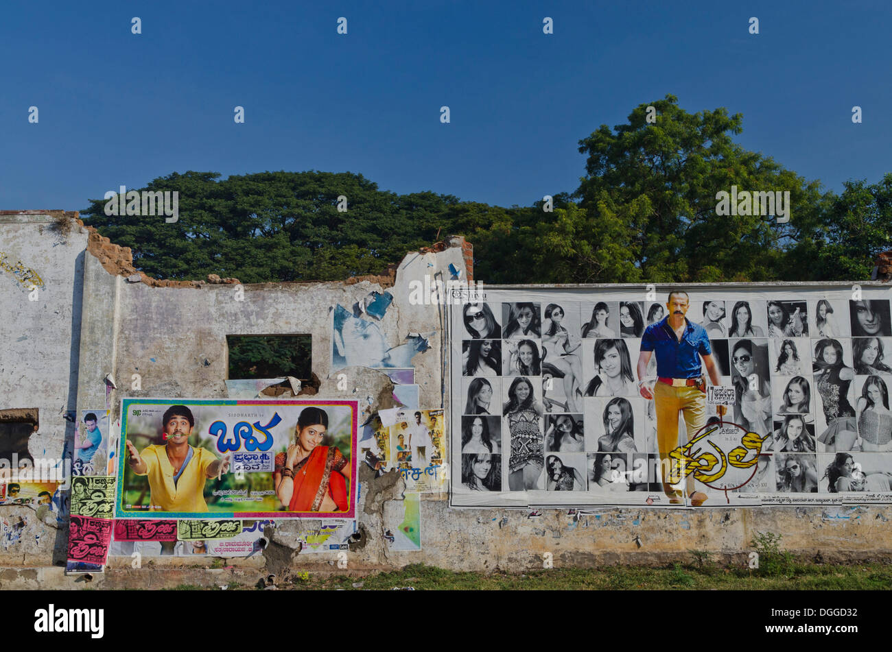Cinema posters on wall of a broken down house, Mysore, India, Asia Stock Photo