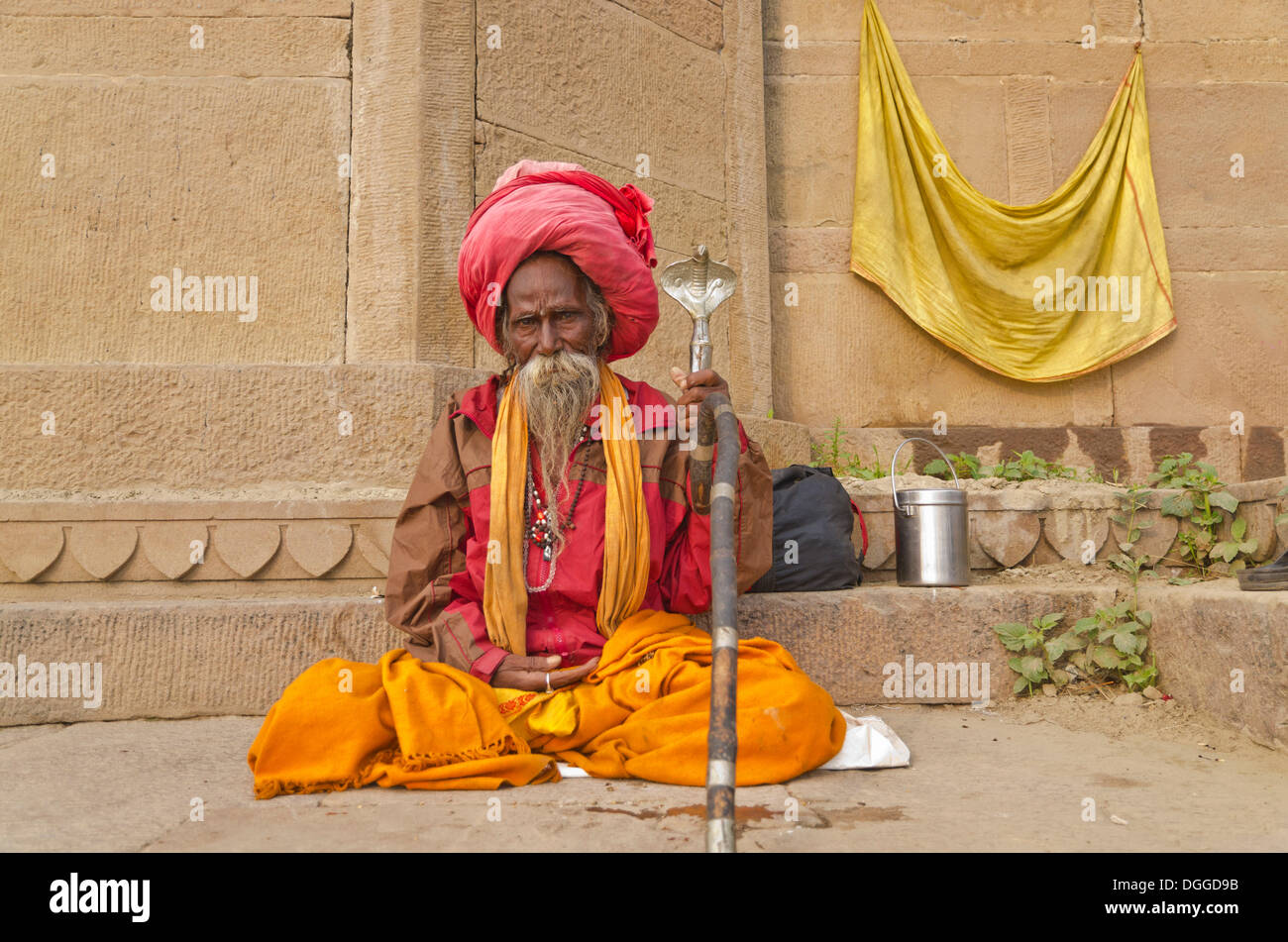 Sadhu, holy man, sitting at one of the ghats of the historic city of Varanasi, India, Asia Stock Photo