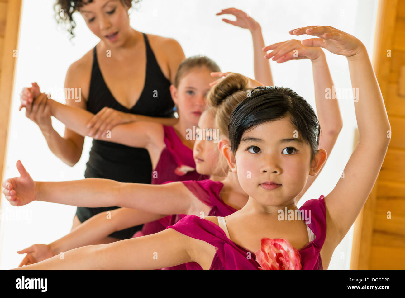 Ballerinas practising with ballet teacher Stock Photo