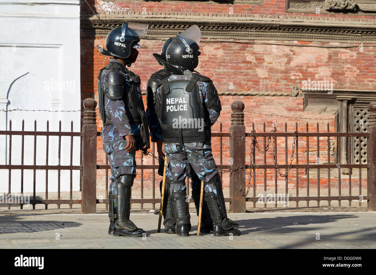 A group of policemen observing a demonstration at Durbar Square, Kathmandu Valley, Kathmandu, Kathmandu District, Bagmati Zone Stock Photo