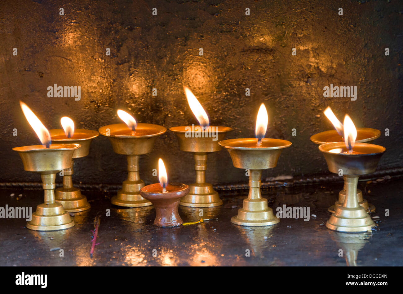 Butterlamps, lighted, as offerings at Swayambhunath Stupa, Monkey Temple, Kathmandu Valley, Kathmandu, Kathmandu District Stock Photo