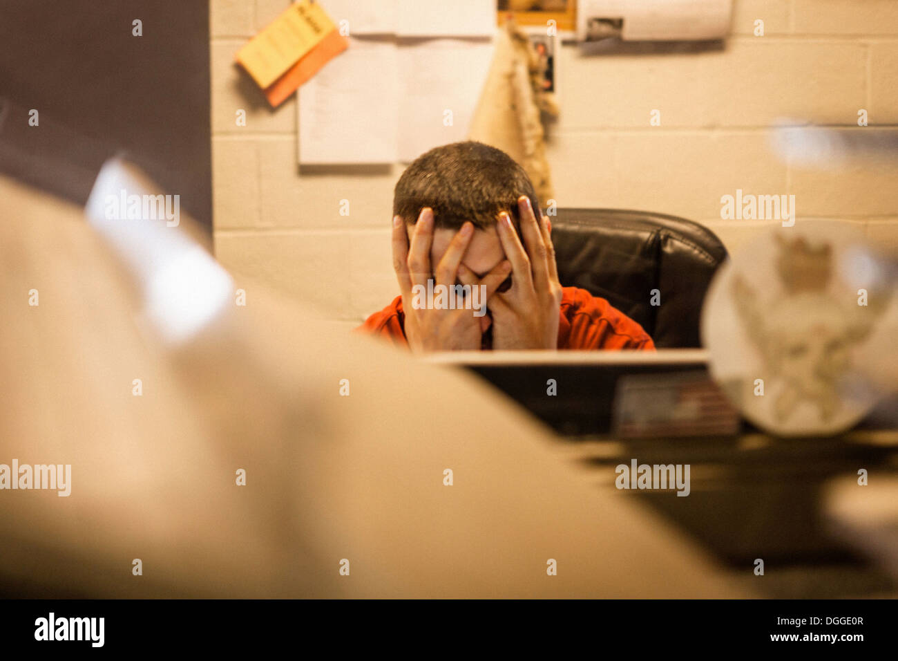 Overworked business owner sitting in warehouse office Stock Photo Alamy