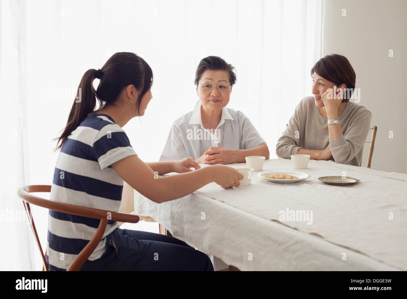 Three generation family at table Stock Photo