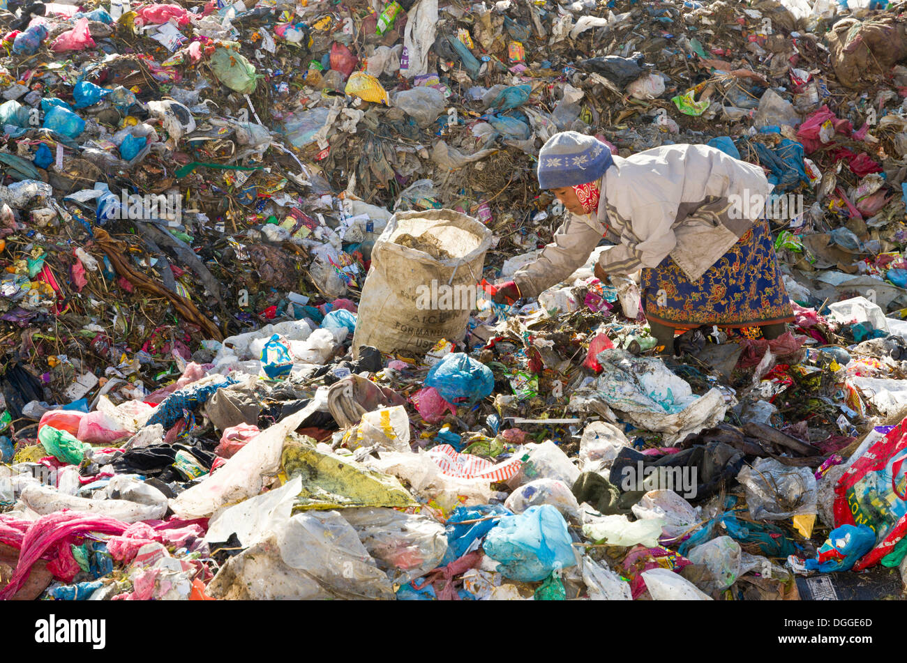Woman sorting out garbage at Aletar garbage dump, earning 300-400 nepali rupees a day, Aletar, Kathmandu District, Bagmati Zone Stock Photo