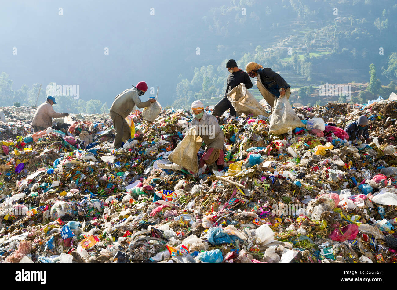 Workers sorting out garbage at Aletar garbage dump, earning 300-400 nepali rupees a day, Aletar, Kathmandu District Stock Photo