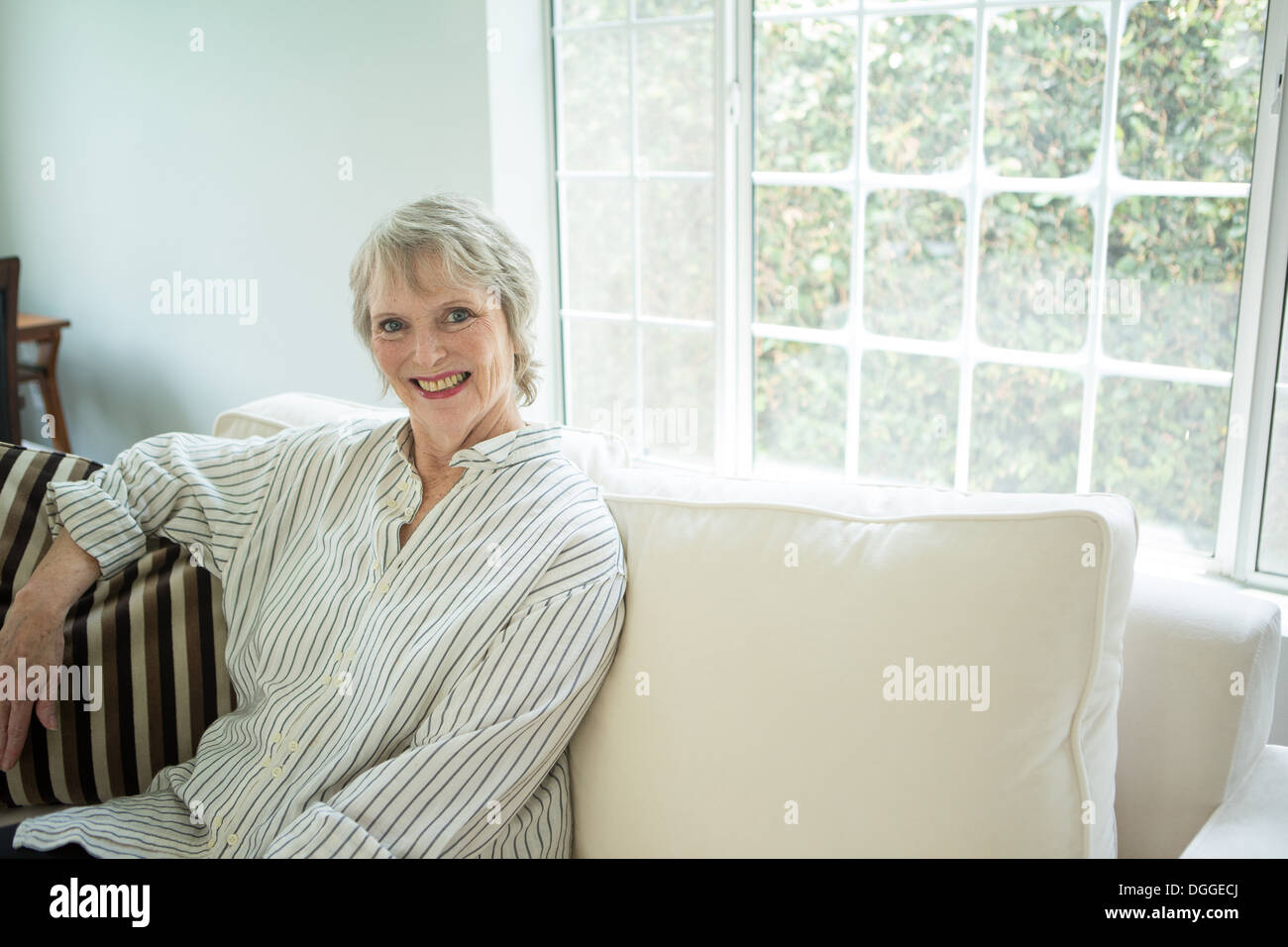Senior woman alone sofa hi-res stock photography and images - Alamy